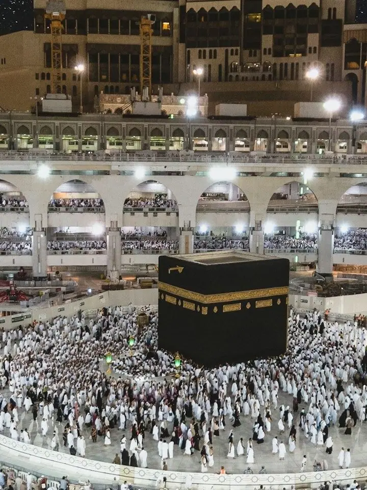 The Kaaba seen through an arch of Masjid al-Haram, Makkah
